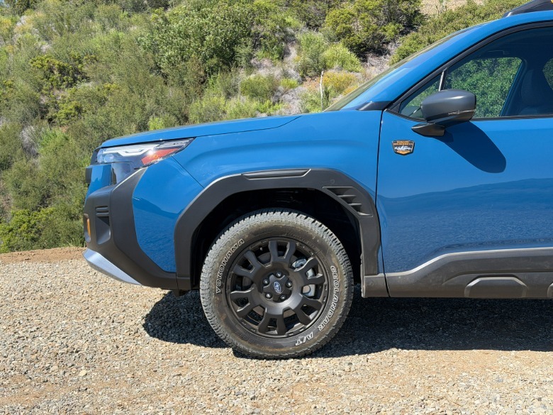 Front end of a blue 2027 Subaru Forester Wilderness Hybrid