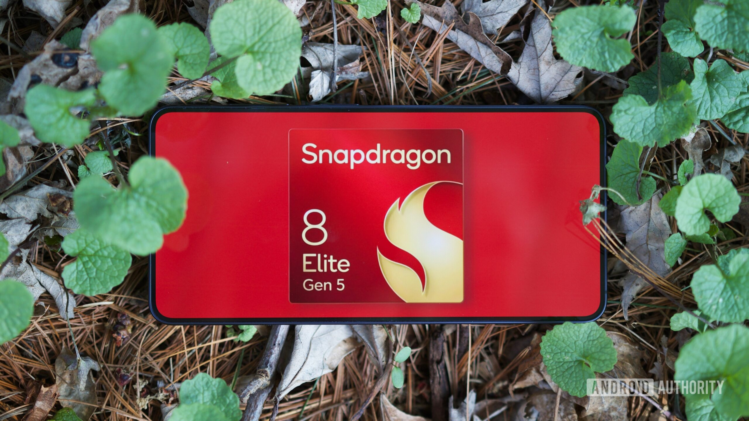 Samsung Galaxy S26 with its screen on, showing a logo of the Snapdragon 8 Elite Gen 5 chip.