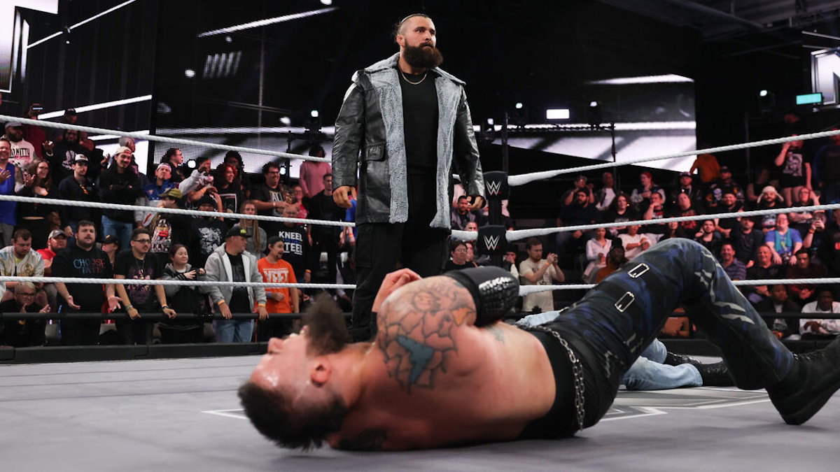 Tony D'Angelo standing over Josh Briggs in WWE NXT