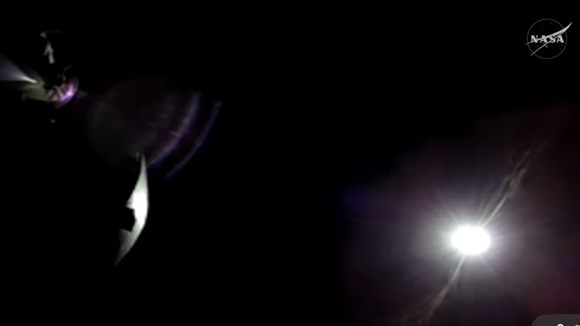 a shimmer of light appears among a screen of black on the bottom right.