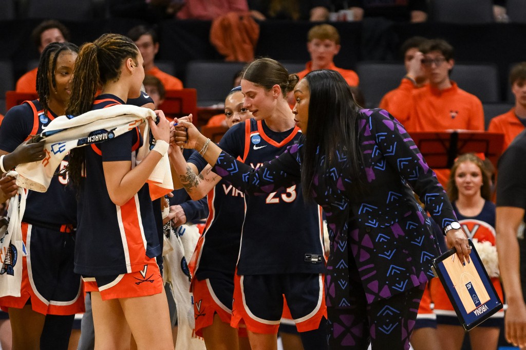 Virginia Cavaliers head coach Amaka Agugua-Hamilton speaks with her team during the second quarter of the game against the Texas Christian University Horned Frogs in the Sweet Sixteen game of the Sacramento Regional 4 of the women's 2026 NCAA Tournament at Golden 1 Center. 