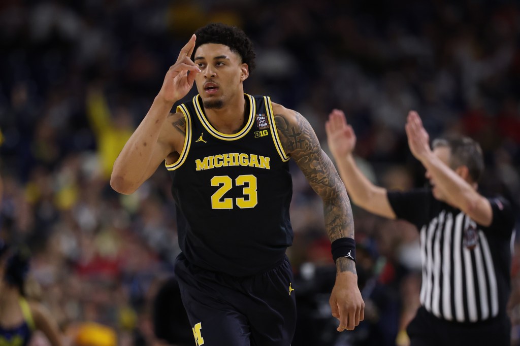 Yaxel Lendeborg #23 of the Michigan Wolverines reacts against the Arizona Wildcats during the second half in the Final Four of the 2026 NCAA Men's Basketball Tournament at Lucas Oil Stadium on April 04, 2026 in Indianapolis, Indiana.